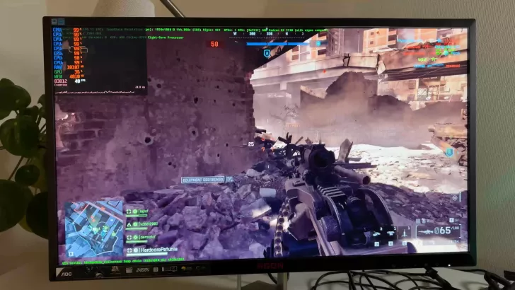AOC AGON monitor displays Battlefield gameplay with AMD FX-8350 CPU and Radeon RX 5700 GPU stats.