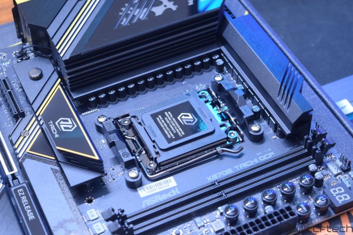 ASRock X670E Taichi OCF motherboard with REMOVE text on CPU socket in a tech setup.