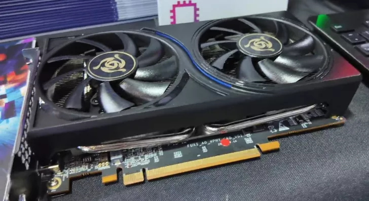 A graphics card with two cooling fans, displaying a 'FUXI_AO 4PHY' label on the circuit board.