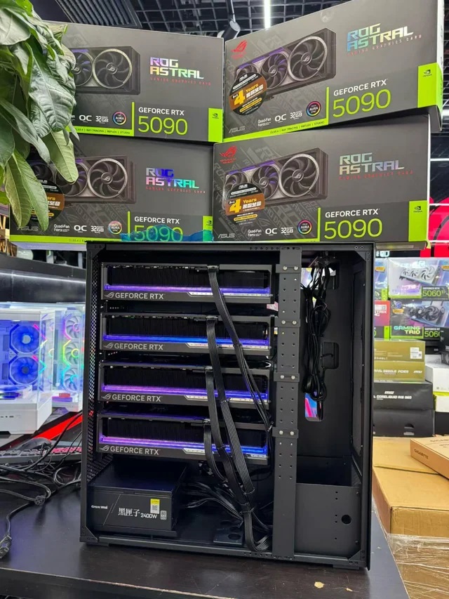 A setup displaying multiple ASUS ROG Astral GeForce RTX 5090 graphics cards inside a computer case next to boxes labeled with 'GEFORCE RTX 5090'.
