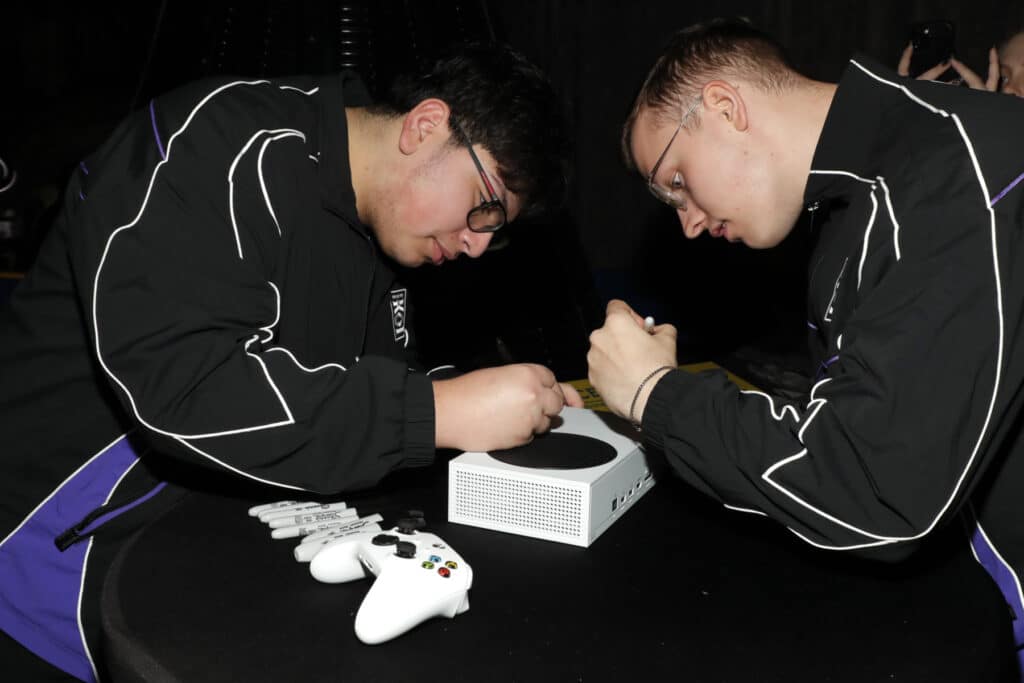 monster party attendees signing autographs