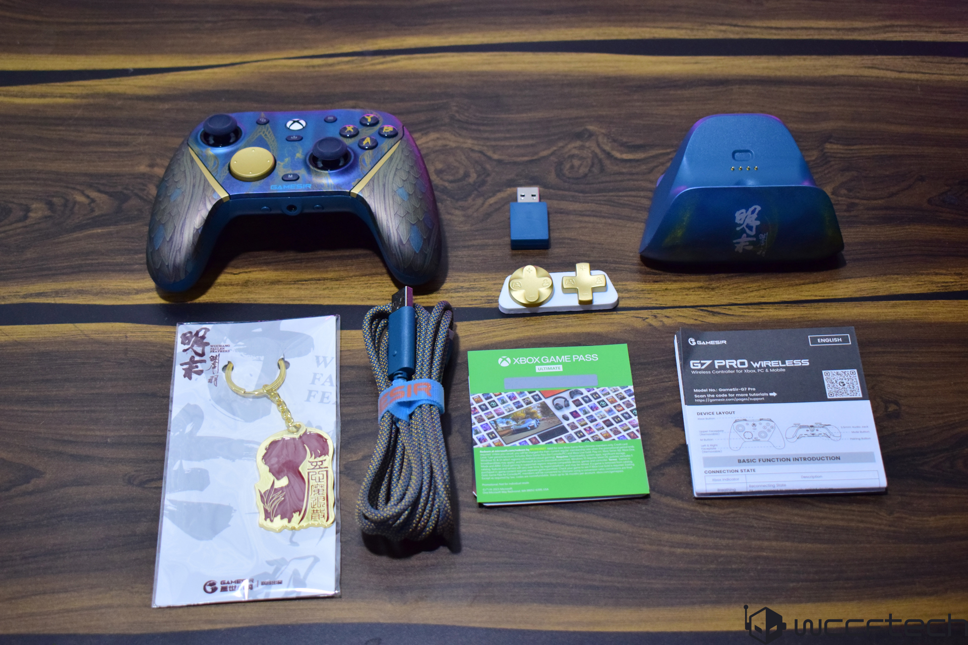 GameSir G7 Pro Wireless controller set with manual, Xbox Game Pass card, and accessories on a wooden table.