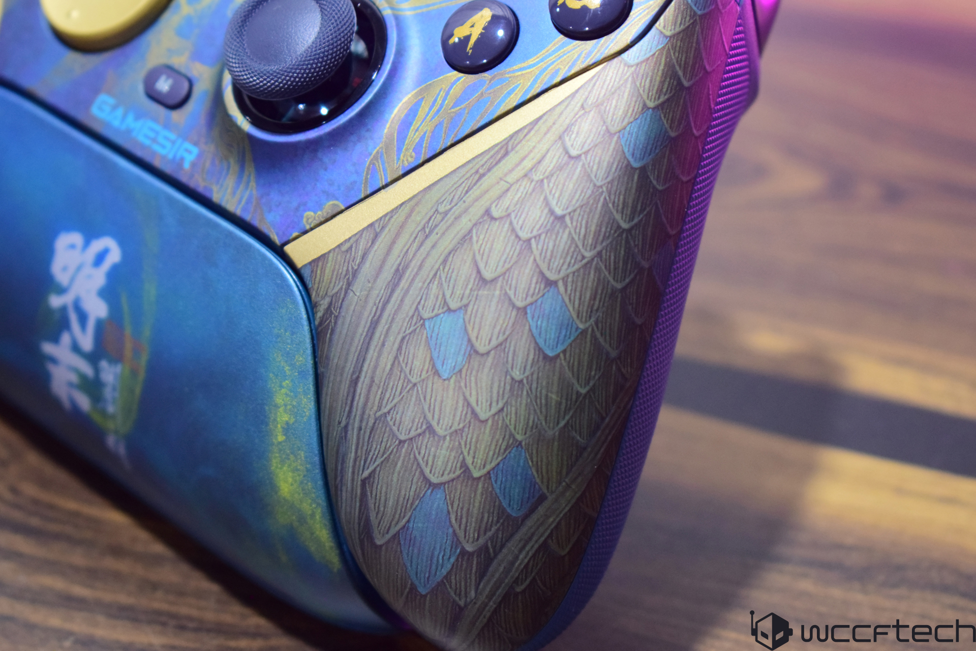GameSir controller with dragon scale design on table, features “GAMESIR” branding.