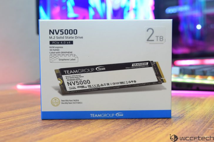 TeamGroup NV5000 M.2 Solid State Drive box with 2 TB capacity on a wooden desk.