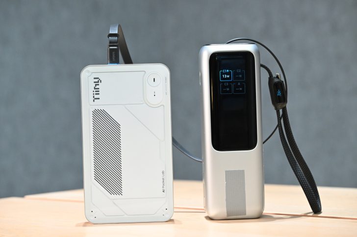 A Tinky AI Pocket Lab device connected to a silver gadget displaying 'C1* 13W' on its screen.