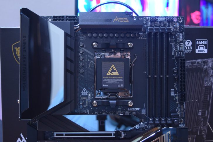 The image shows an MSI MEG Enthusiast Gaming motherboard with a visible CPU socket, DDR5 RAM slots, and '64MB BIOS' label on the board.