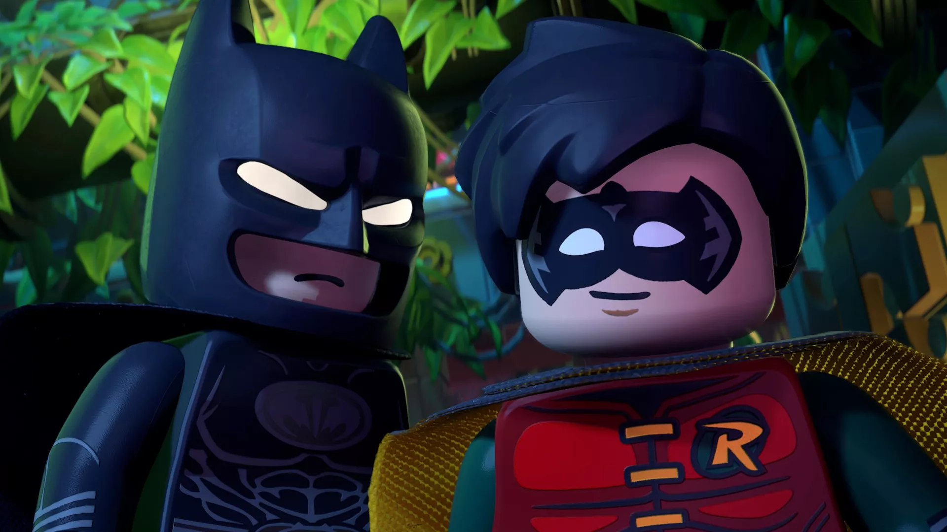 Lego Batman and Robin are standing in a jungle environment in a video game scene.
